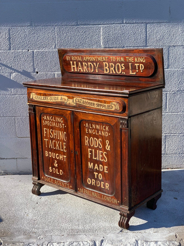 Antique walnut dresser with advertising